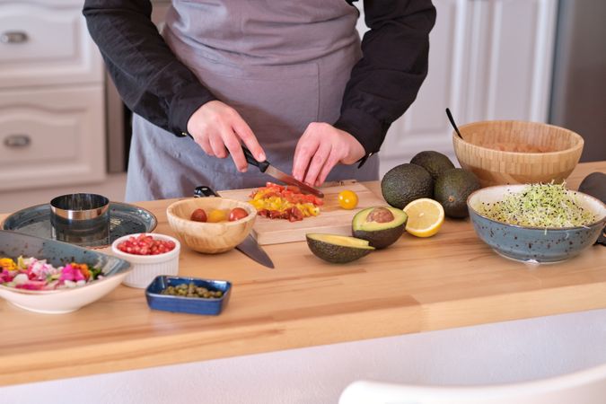 Crop cook preparing tartar at table