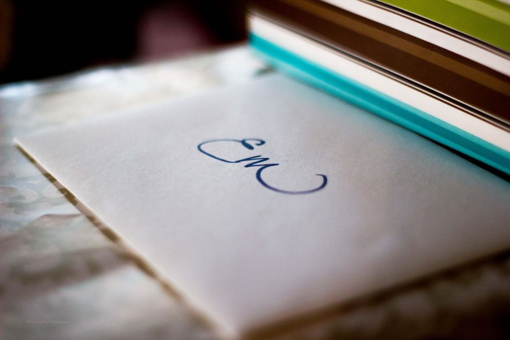 E M written on an envelope on a table