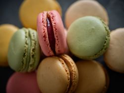 Assorted sweet macaroons on table