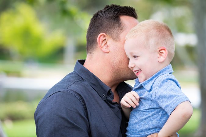 Young Father and Son Having Fun At The Park