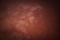 Smoke over water in brown light