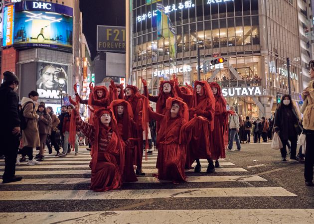 Japan - Tokyo, Shibuya Japan - November 29th, 2019: Red Rebel Brigade mid dance at protest