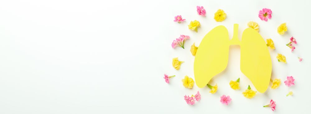 Banner of yellow lungs surrounded with flowers with copy space