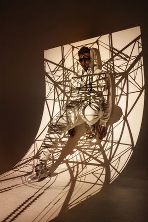Black man dancing under bright light