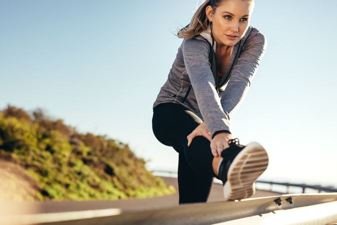 Fitness woman doing workout on road