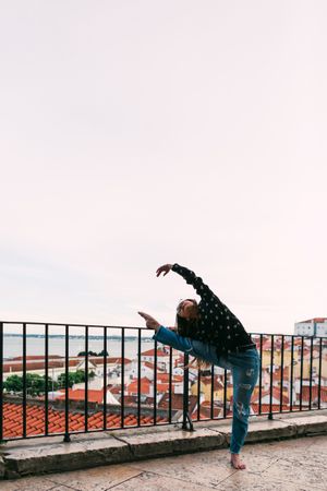 dancer dancing against cityscape