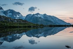 Crystal lake reflecting cloudy sky