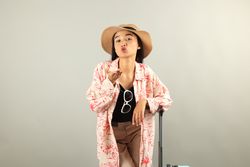 Portrait of Young Asian Woman on Grey Background, Summer Vacation Concept