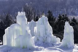 Ice structures against the forest in the wintertime