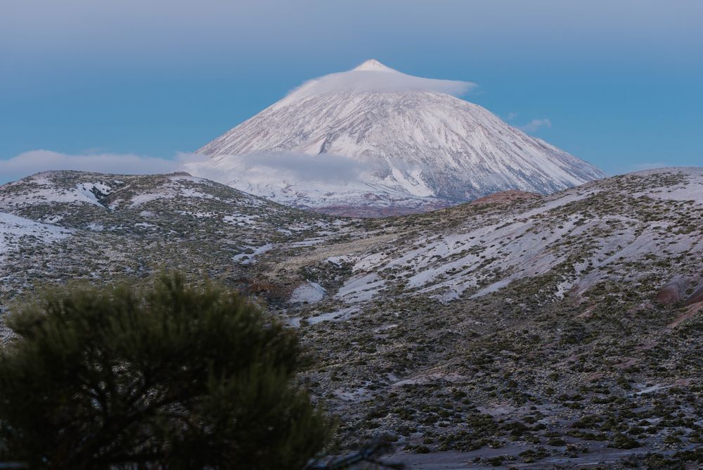Clouds near snowy mountain
