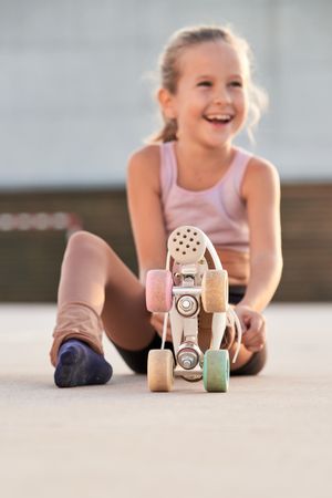 Happy girl in roller skate in street