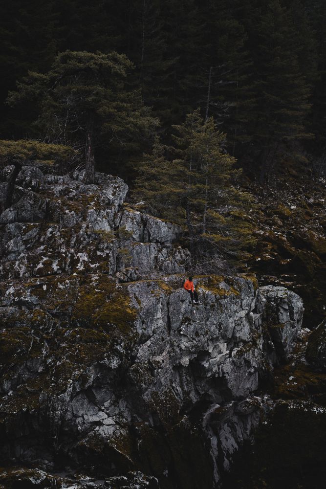 Top view of a person on rocky hill in sparse outdoor
