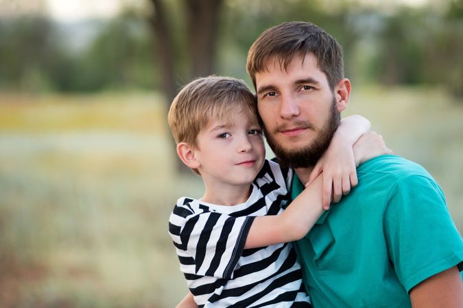 Affectionate father with son outdoor