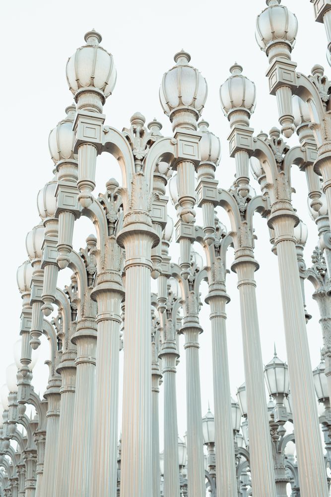 row with high silver column lantern and touching hair in Los Angeles