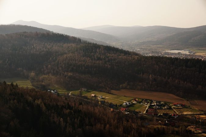 Picturesque view of village surrounded by woods