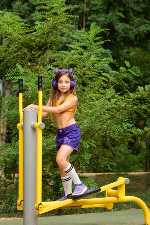 Schoolgirl works out on sports ground