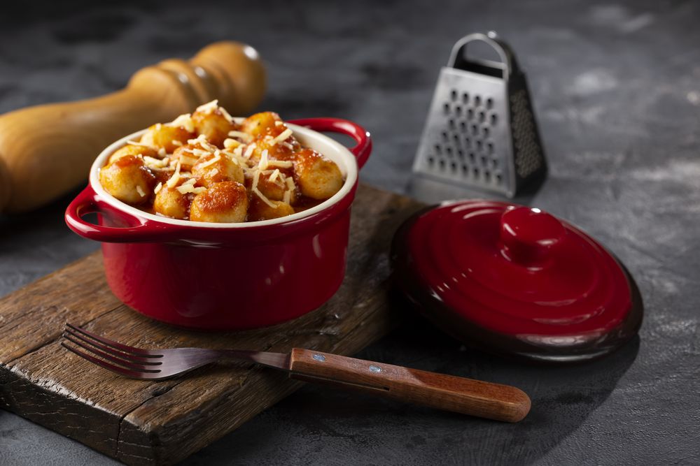 Gnocchi with tomato sauce and grated Parmesan cheese.