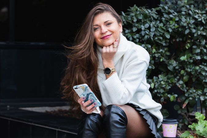 Content woman using smartphone in park