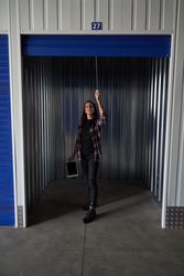 Woman opening metal self storage