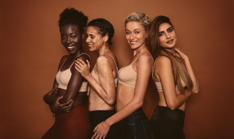 Female models standing together and smiling