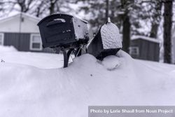 Mailboxes atop a snowy pile 4Z2z14