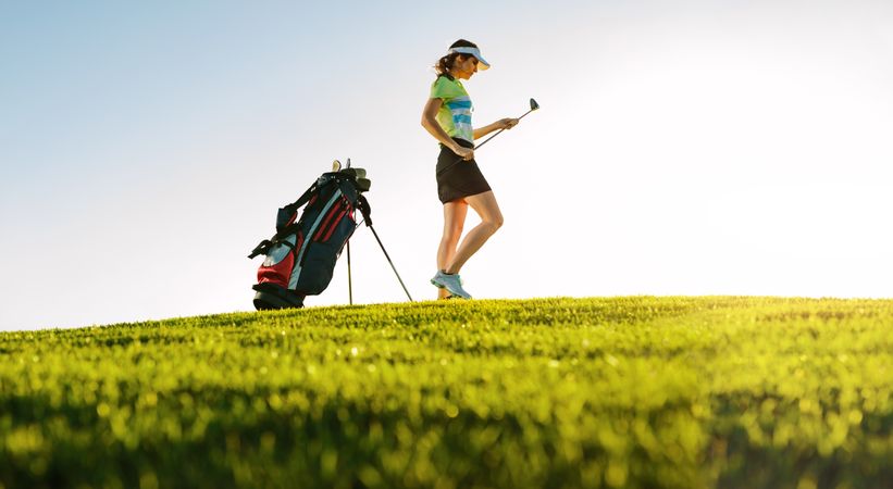 Professional female golfer on golf course