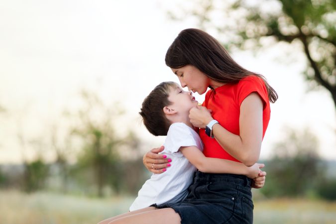Affectionate mom with son outdoor