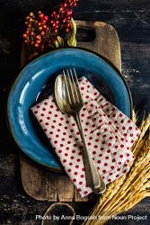 Autumn table setting with polka dot napkin, wheat and berry garnish 5qgrYb