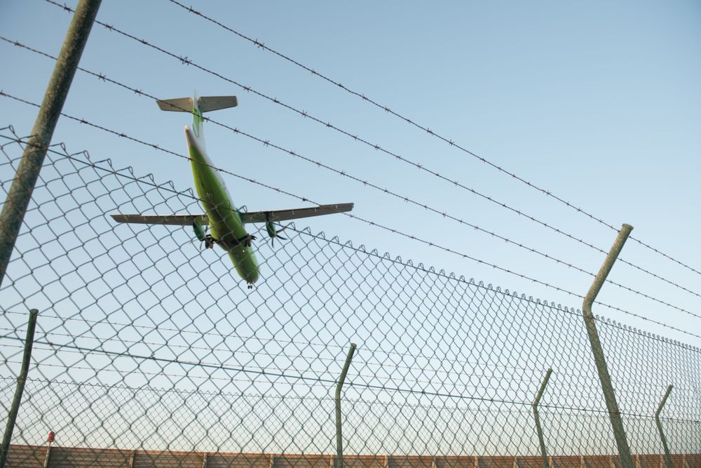 Plane behind security fence