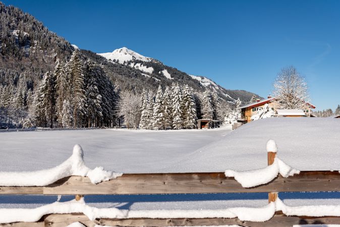 Winter landscape snow-covered nature and fence in the Bavarian Alps, Germany