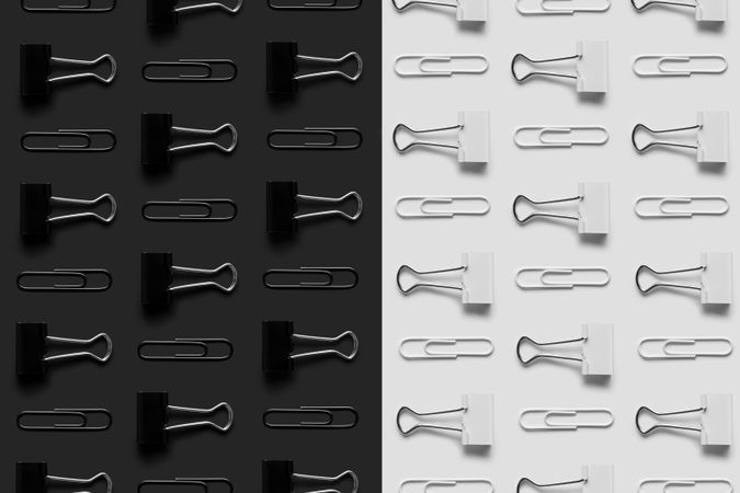 Paper clips and bider clips on monochrome background