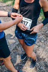 Female placing the race number
