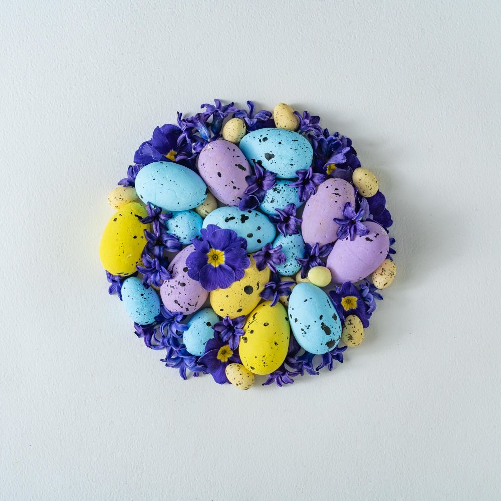 Easter eggs and purple flowers and leaves