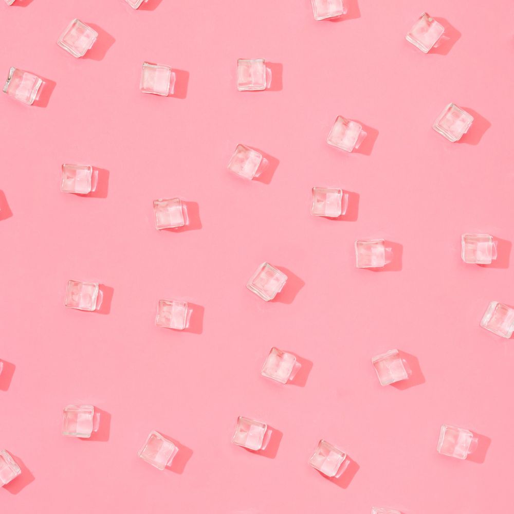 Ice cubes pattern on pastel pink background