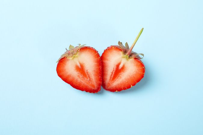 Tasty strawberry on blue background. Summer berry