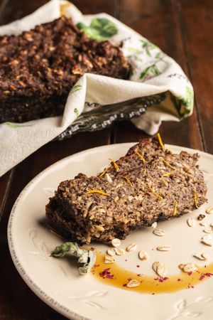Crispy appetizing cake on plate on wooden surface