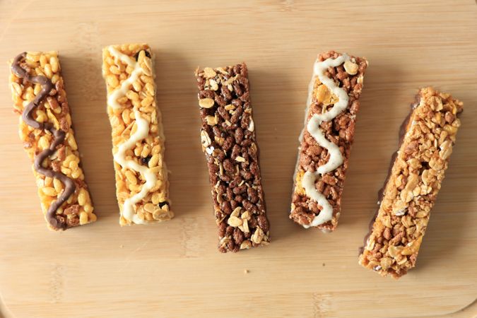Various Healthy Cereal Granola Energy Bar on Wooden Background