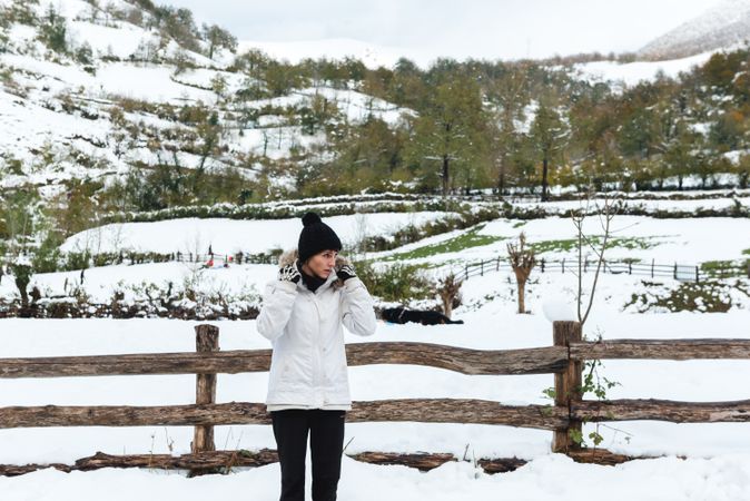 Woman in winter clothes looking away
