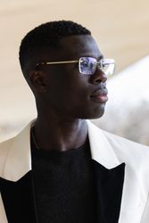 Stylish Black businessman in eyeglasses in town