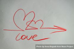 Valentine Day holiday card concept with love, hearts and arrow scribbled on paper 0yXXzj