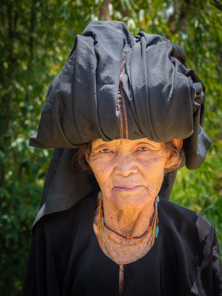Sulawesi Island, Indonesia - August, 15 2015: Mature woman in shed in village