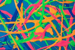 Pattered bright paint on blue background