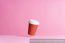 One disposable coffee cup on pink background 5rEG70
