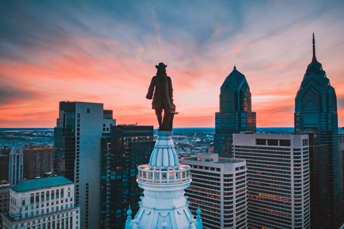 William Penn statue in Pennsylvania city skyline in Philadelphia, US at sunset