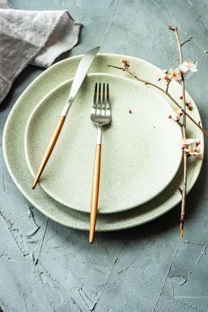 Spring table setting with cherry blossom tree branch