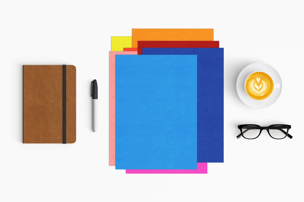 Modern workspace with coffee cup, smartphone, paper, notebook and tablet copy space