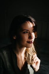 Portrait of woman in dark room