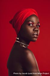 Stylish woman with red turban in studio 4BJnX4
