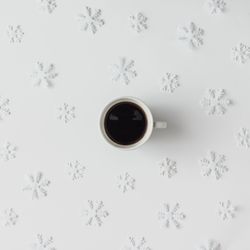 Coffee cup with winter light light background