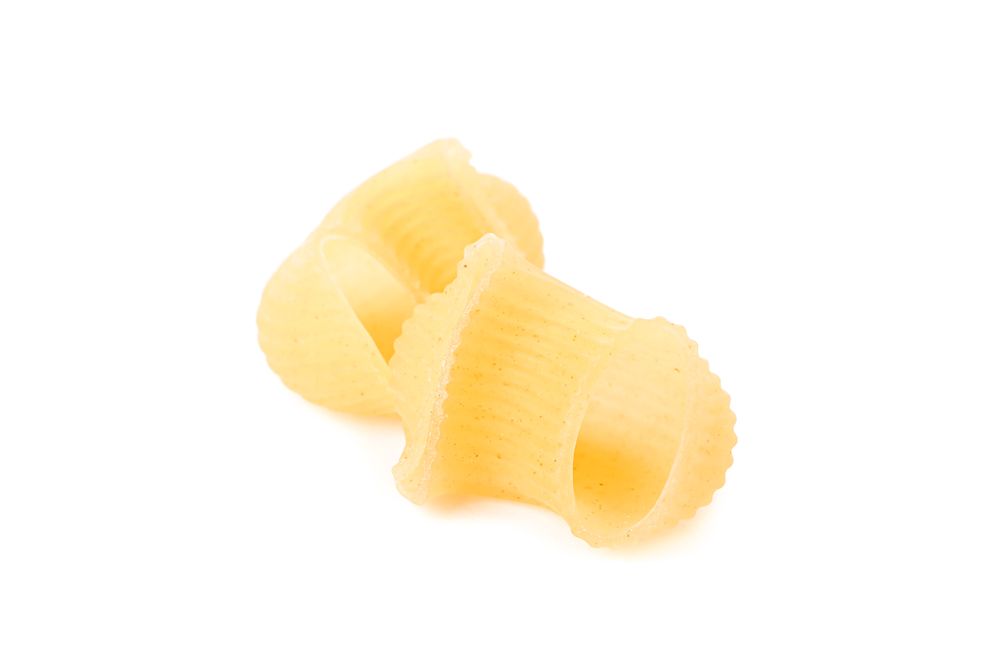 Pasta isolated on studio background, closeup. Dry raw whole pasta